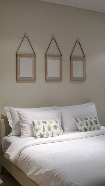 istock Comfortable throw cushion on the white pillow and white bed sheet in the bedroom 1198160414