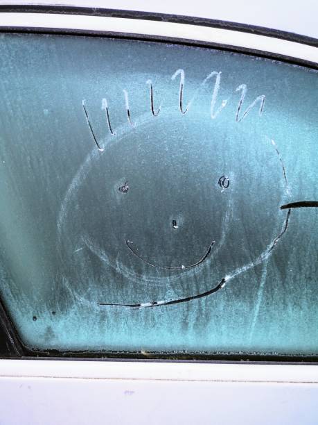 istock Smiley on frozen car window 1198161485