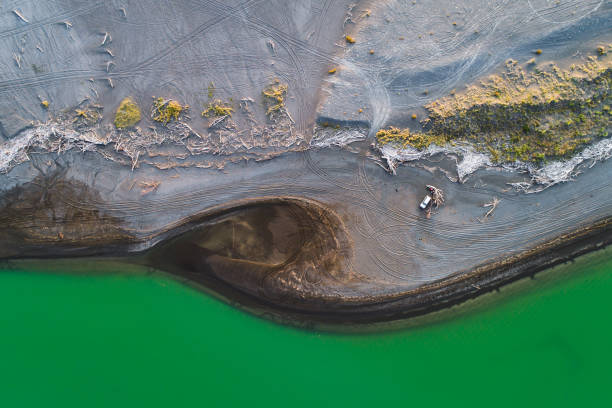 istock looking down at lake with green colour. 1198164666