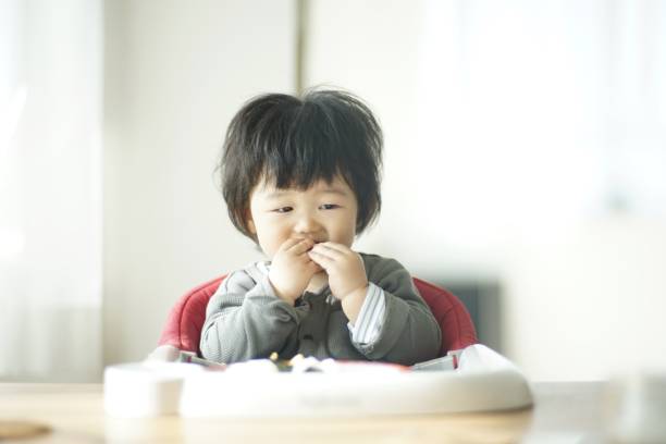 istock Baby boy eating at home 1198172339