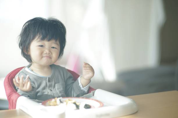 istock Baby boy eating at home 1198172340