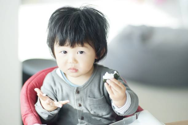 istock Baby boy eating at home 1198172369