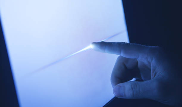 istock Male hand touching in screen at night. 1198172400