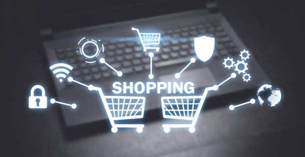istock Shopping carts on laptop background. Shopping 1198172408