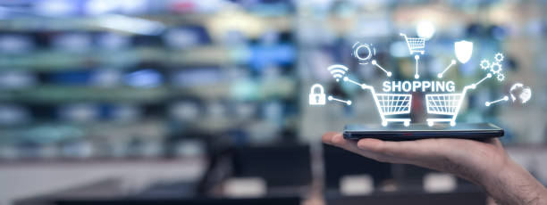istock Male hand showing smartphone in electronics store. Shopping 1198172411