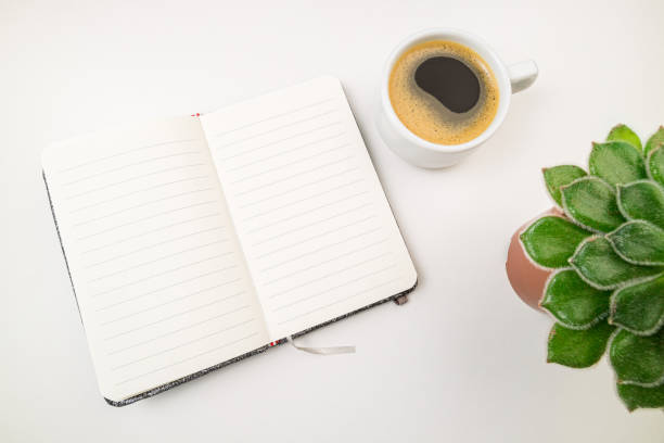 istock Flat lay compositions with notebook, plant and coffee cup on white desk. Business, trends, freelance, education, studing, writing concept 1198179294