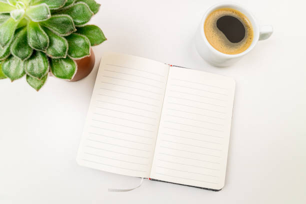 istock Flat lay compositions with notebook, plant and coffee cup on white desk. Business, trends, freelance, education, studing, writing concept 1198179339