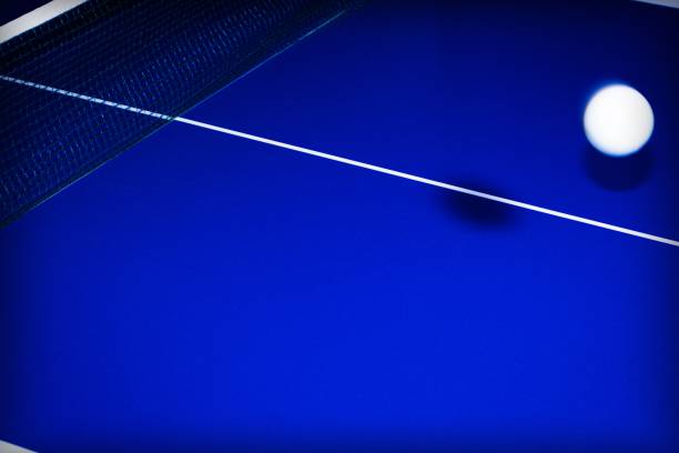 istock background with ball for table tennis over a table in blue with white lines 1198182625