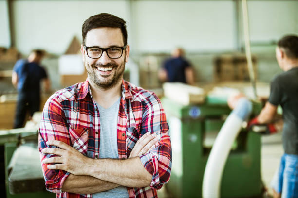 istock Happy manager with crossed arms in a workshop. 1198185734
