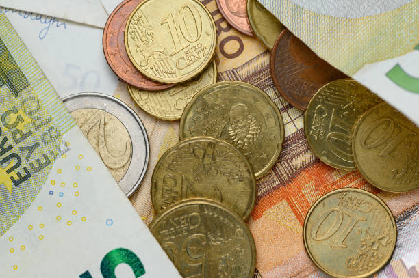 istock Euro banknotes and coins 1198190166