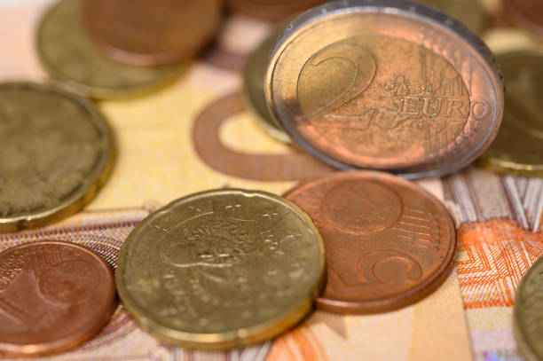 istock Euro banknotes and coins 1198190180