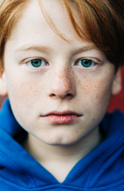 istock Close-up portrait of boy with blank expression 1198195302