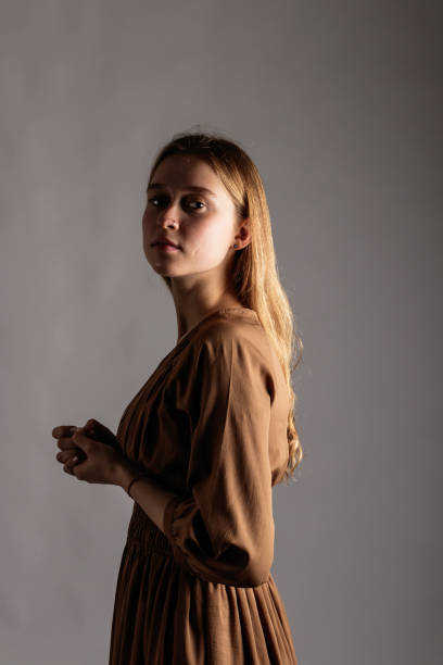 istock Young woman in brown. 1198196149