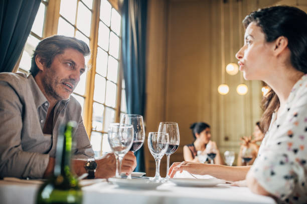 istock Modern couple on a date in restaurant 1198197157