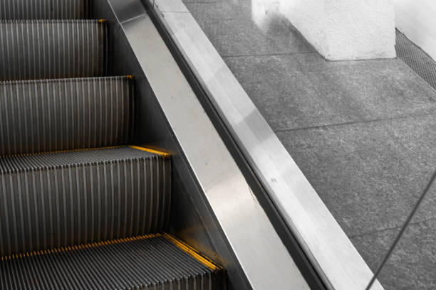 istock Ditry stairs on Escalator with yellow strips. 1198200589
