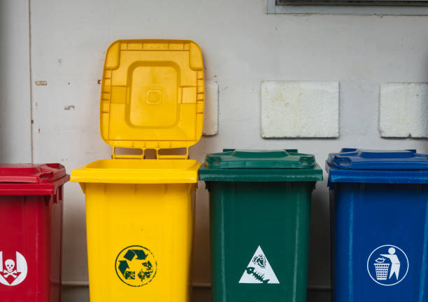 istock Garbage Trash Bins for collecting a recycle materials. Garbage trash bins for waste segregation. Separate waste collection food waste, plastic, paper and danger waste. Recycling. Environment. 1198200828