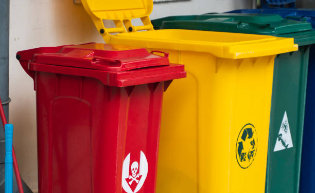 istock Garbage Trash Bins for collecting a recycle materials. Garbage trash bins for waste segregation. Separate waste collection food waste, plastic, paper and danger waste. Recycling. Environment. 1198202347