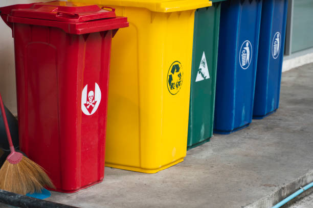 istock Garbage Trash Bins for collecting a recycle materials. Garbage trash bins for waste segregation. Separate waste collection food waste, plastic, paper and danger waste. Recycling. Environment. 1198202418