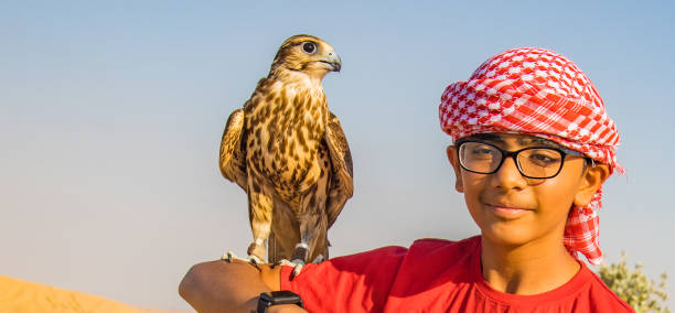 istock Indian Boy with Specs(Eyeglasses) with Falcon on his hand 1198203387