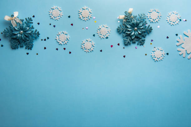 istock Christmas or winter composition. Pattern made of snowflakes on pastel blue background. 1198204243