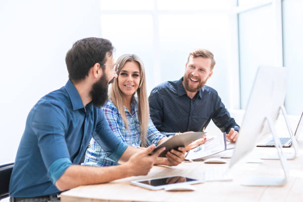 istock group of business people discussing financial documents 1198204313
