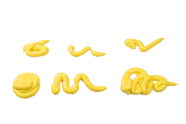 istock Yellow cheese sauce splashes isolated on white background 1198205516