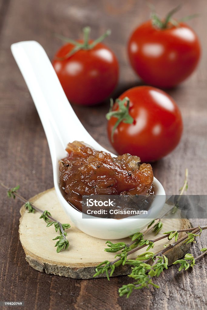 tomato chutney on spoon  Chutney Stock Photo