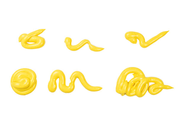 istock Yellow sauce splashes isolated on white background. 1198207668