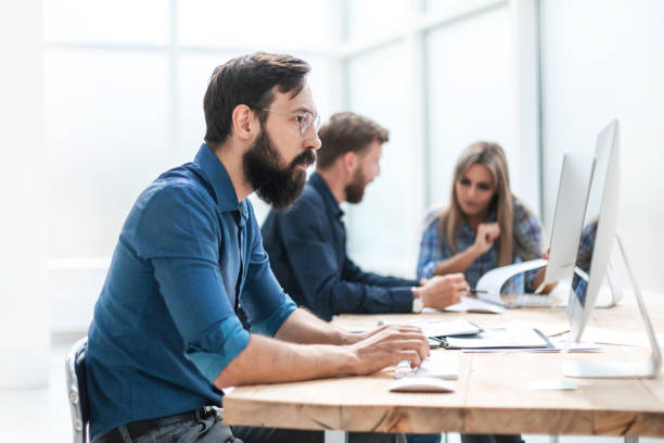 istock businessman uses a computer in the workplace in the office. 1198209387