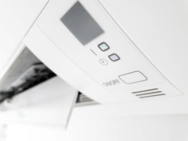 istock Modern air condition unit on a white wall inside the living room. 1198212941