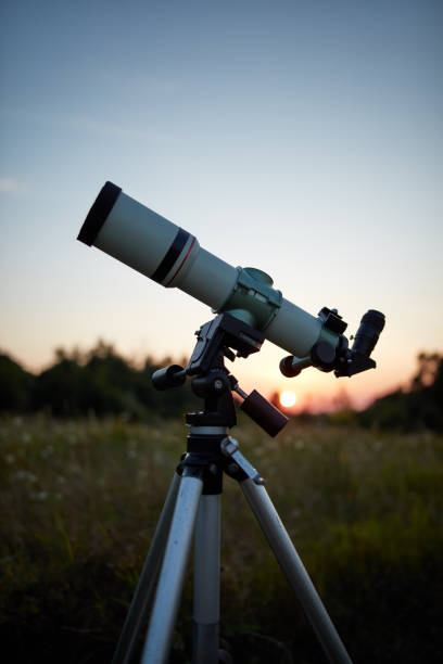 istock Telescope for observing the universe on a meadow outdoors. 1198215412