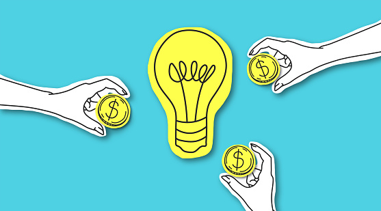 Perspective way to invest money. Hands with dollar sign coins around yellow light bulb over blue background