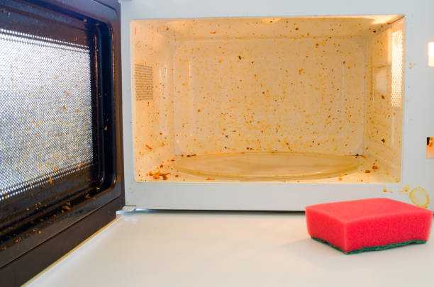istock Open microwave. Dirt from food inside. Close-up 1198217621