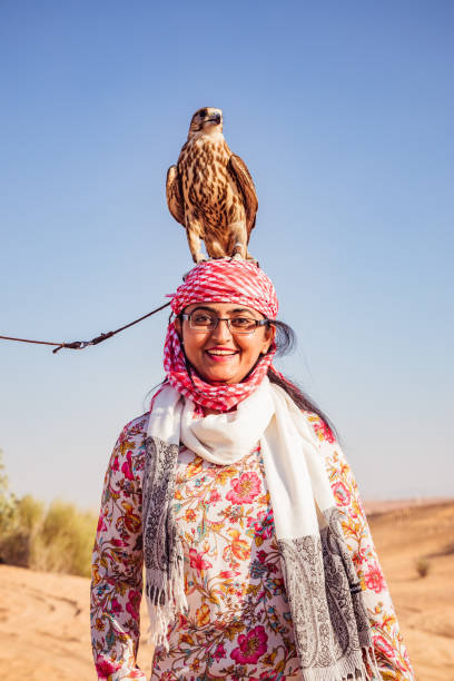 istock Indian Women with Falcon on head 1198218070