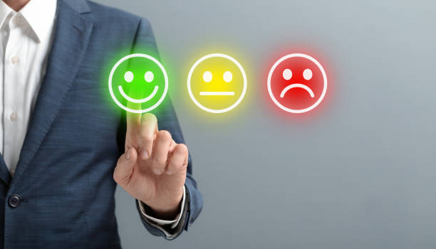 istock Man hand choose the happy face smile face icon over gray 1198218922