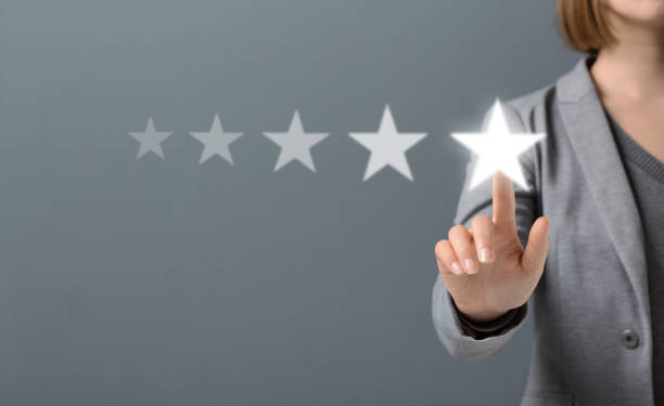 istock Hand of Client pressing Five Star Excellent survey Rating 1198219085