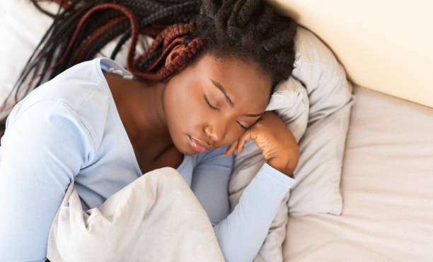 istock Asleep Afro Lady Taking Rest Lying In Bed At Home 1198221086