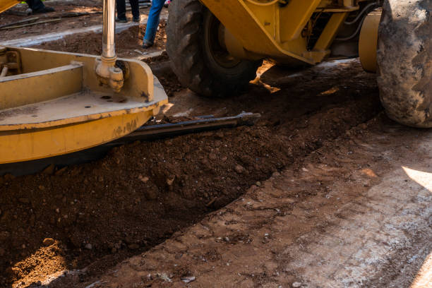 istock Details of grader is working on road construction. Grader industrial machine on construction of new roads. Heavy duty machinery working on highway. Construction equipment. Compaction of the road. 1198221294