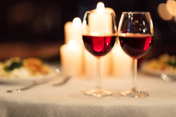 istock Two Glasses Of Red Wine Standing On Table In Restaurant 1198224131