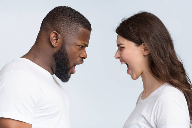 istock Interracial couple arguing, yelling at each other, having relationship crisis 1198224154