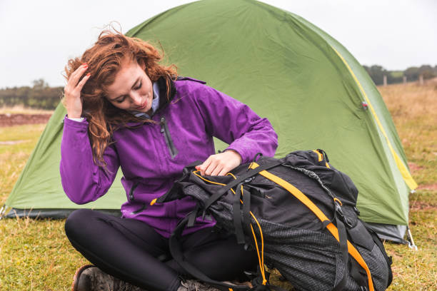 istock Young woman camping on a cloudy day in Cornwall 1198224213