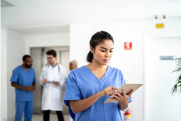 istock Female nurse using tablet at hospital 1198224473