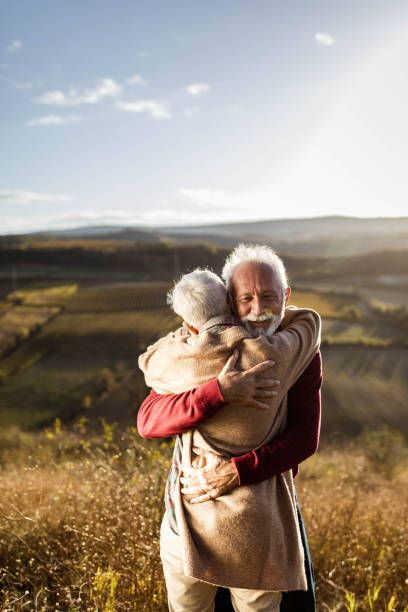 istock Affectionate senior couple embracing in autumn day. 1198224609