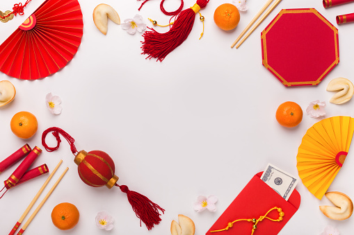 Chinese New Year decorations creating frame on white background, copy space for text