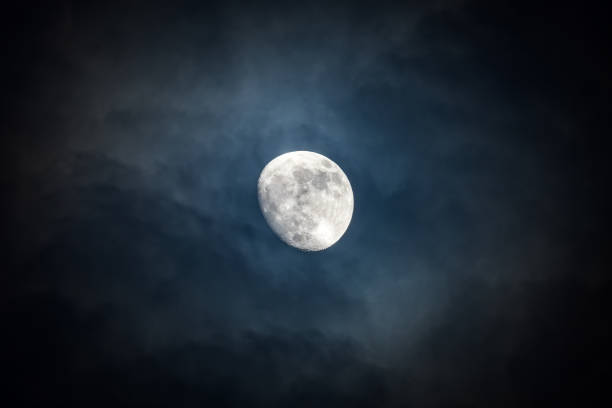 istock Waxing moon encircled by clouds 1198225216