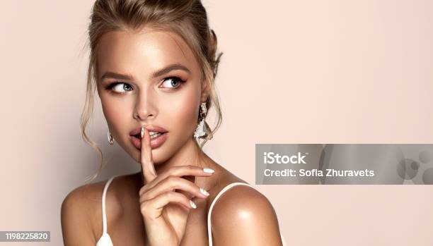 Portrait Of Young Woman With Expression Of Curiosity And Joy On The Face Makeup Cosmetic And Advertisement Stock Photo - Download Image Now