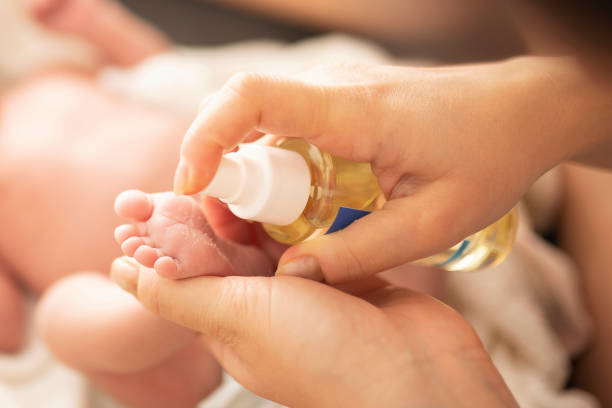 istock Mother makes massage with baby oil 1198226725