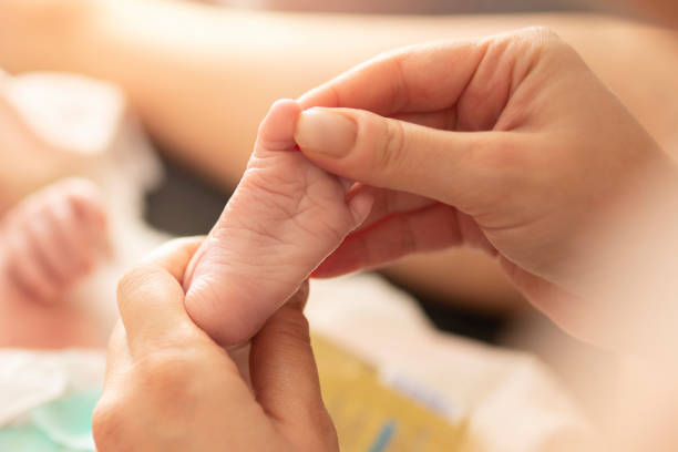 istock Mother makes massage with baby oil 1198226732