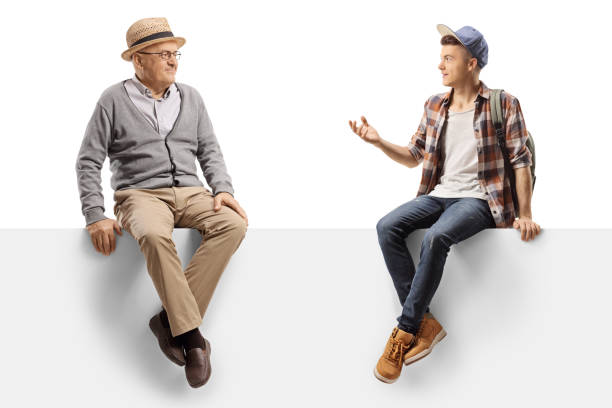 istock Elderly man and a teenager sitting on a panel and talking 1198226782