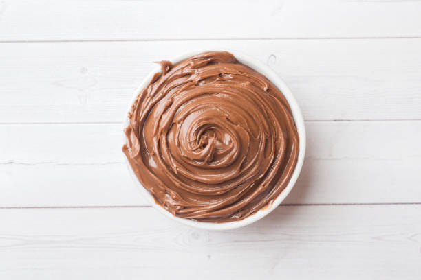 istock Nougat nut chocolate in a plate on a white background. Selective focus. 1198226805